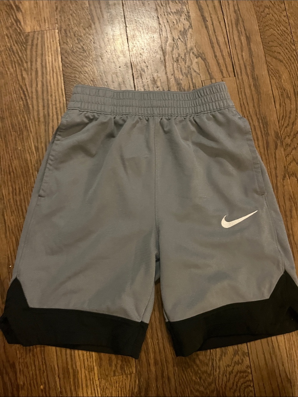 Nike Boys' Gray Athletic Shorts with Black Hem and White Swoosh